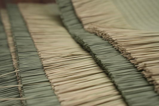 Close-up image of Igusa (rush grass) used in traditional Japanese tatami mat making, showcasing the intricate weaving and natural texture.