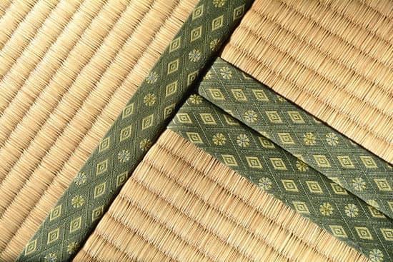 Close-up of traditional Japanese tatami mat with decorative tatami-beri (edging) in a geometric pattern