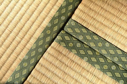 Close-up of traditional Japanese tatami mat with decorative tatami-beri (edging) in a geometric pattern