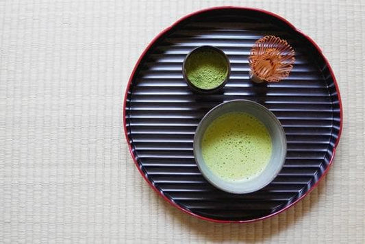 Traditional Japanese tea set on a tatami mat, showcasing the harmony of Japanese culture.